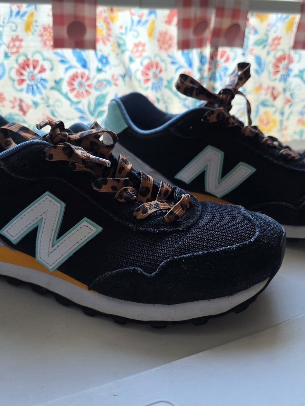 New Balance Black Sneakers with Teal and Yellow Accents